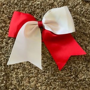 Red and white bow with pony tail holder attached